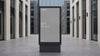 Animated digital signage mockup presented in a realistic public setting with a grey placeholder screen.